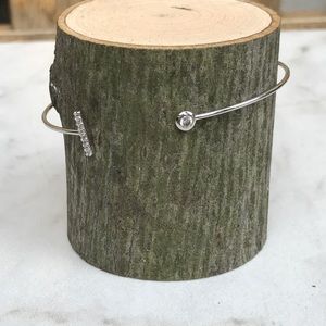 Open silvertone and crystal wire bracelet.